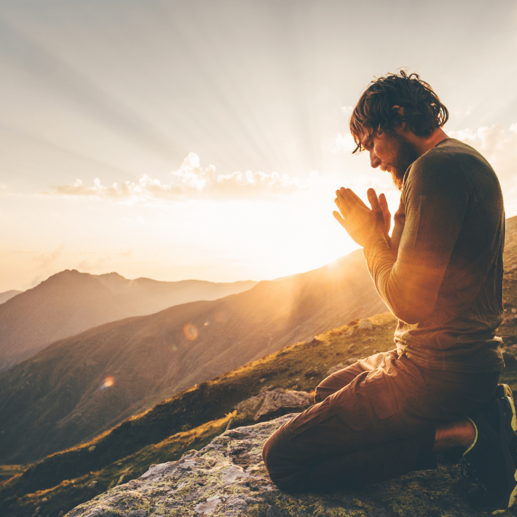 spirituality, man praying on the mountain 